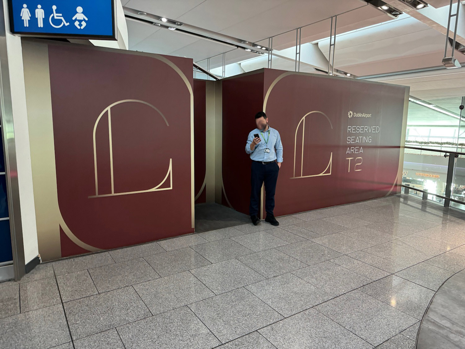 a man standing in front of a sign