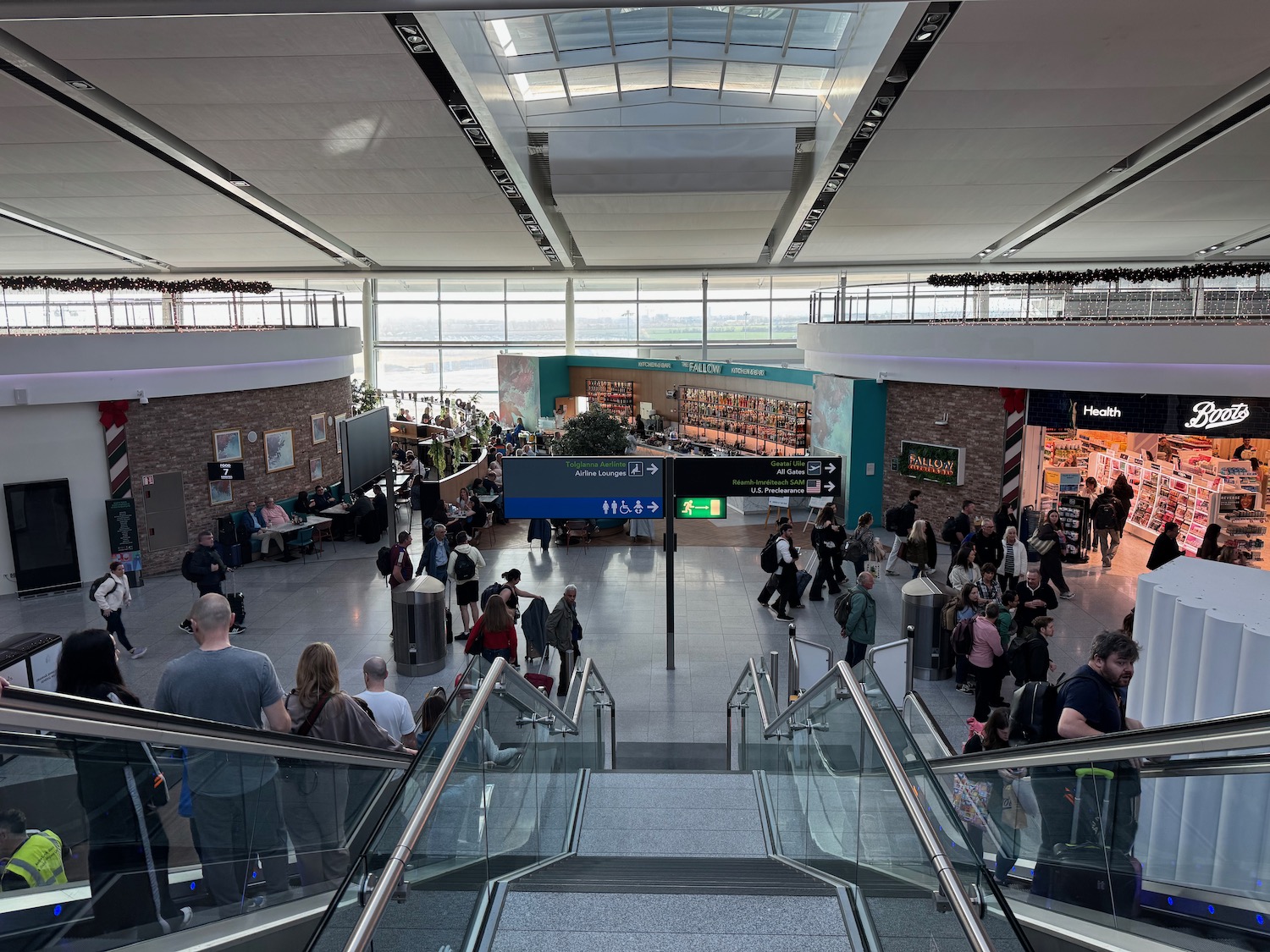 a group of people walking in a large airport