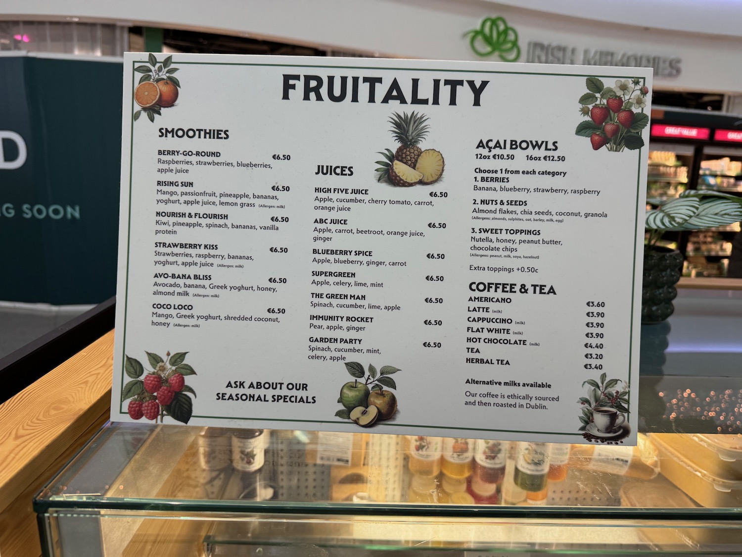 a sign on a glass shelf