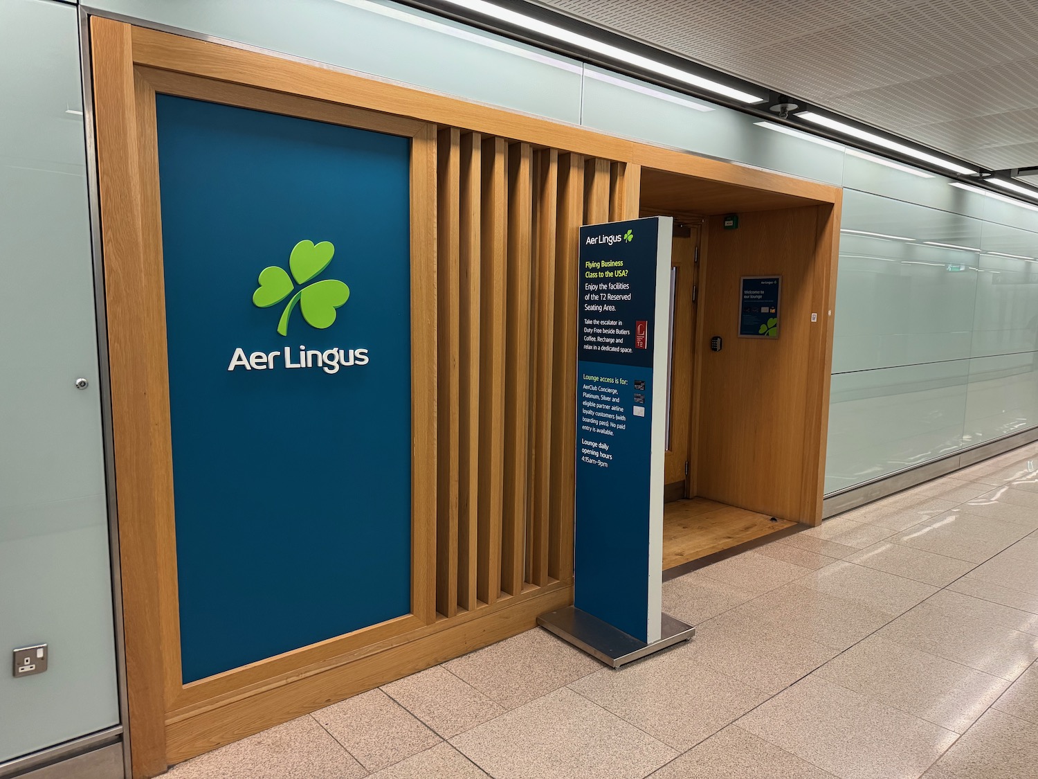 a blue sign with a green logo