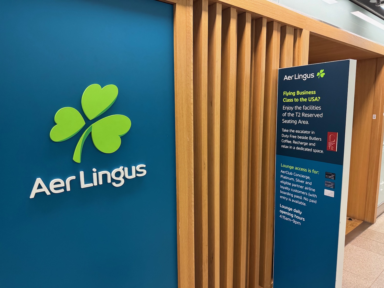 a blue sign with a green clover on it