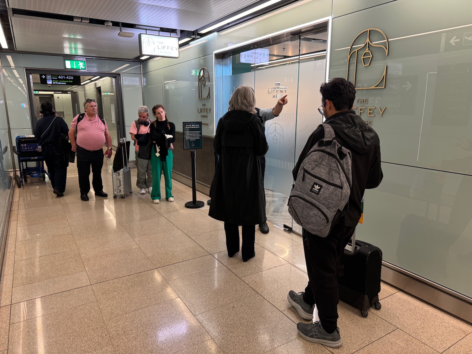 a group of people standing in a hallway