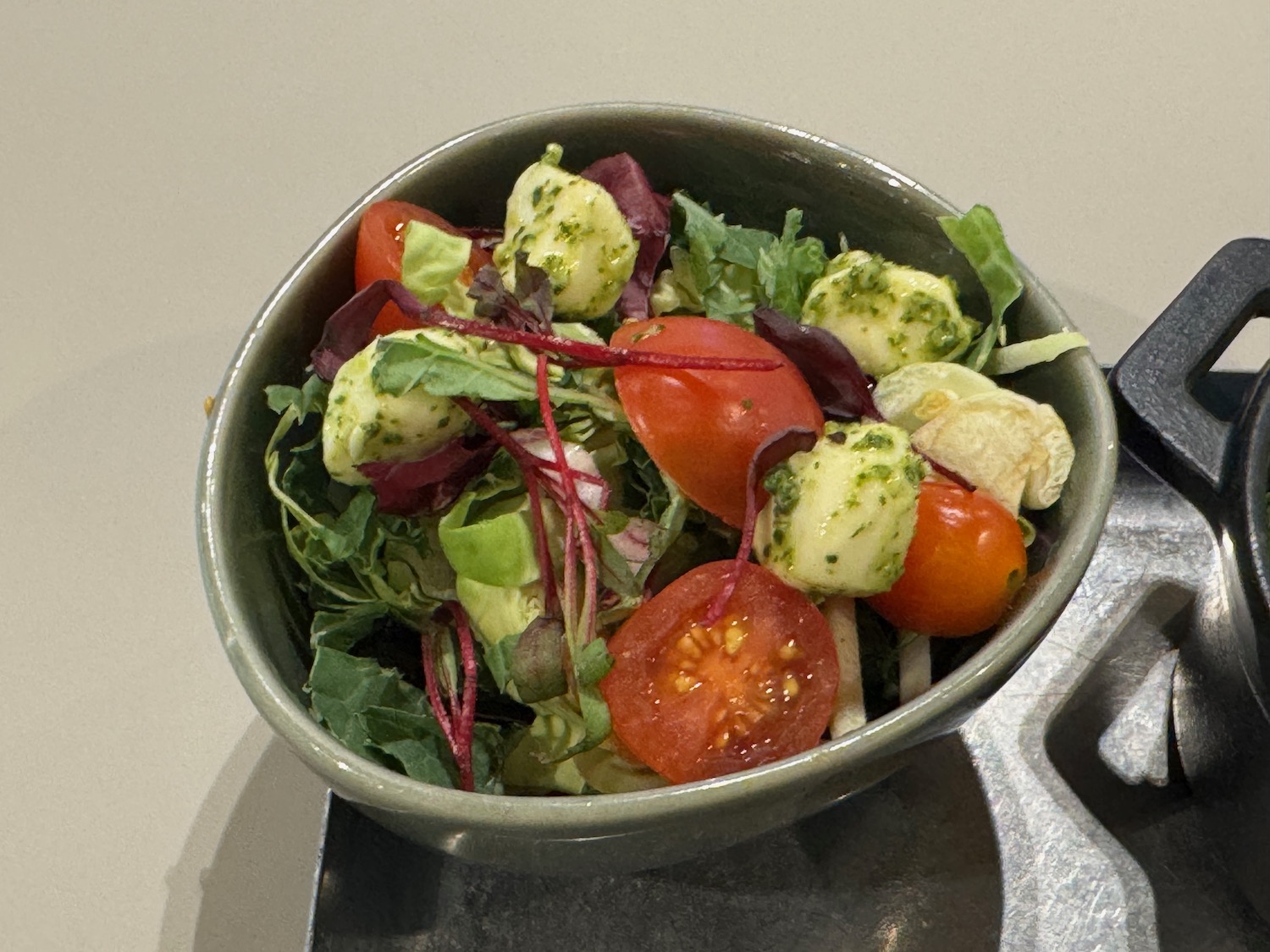 a bowl of salad on a counter