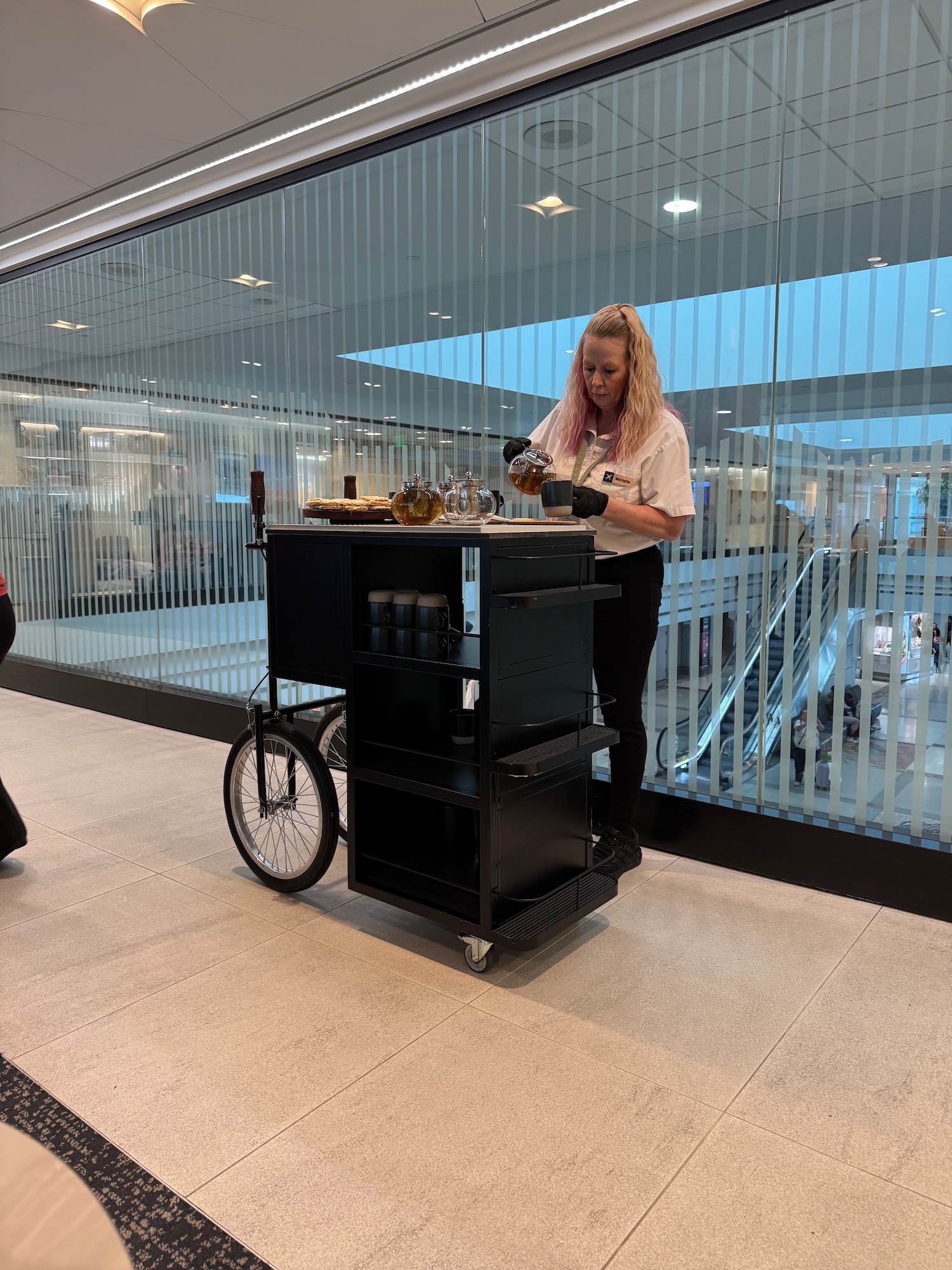 a woman standing next to a cart
