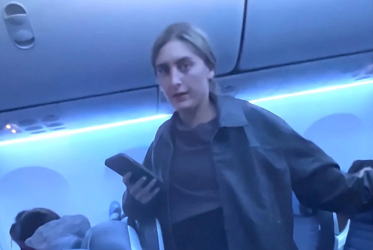 a woman holding a phone