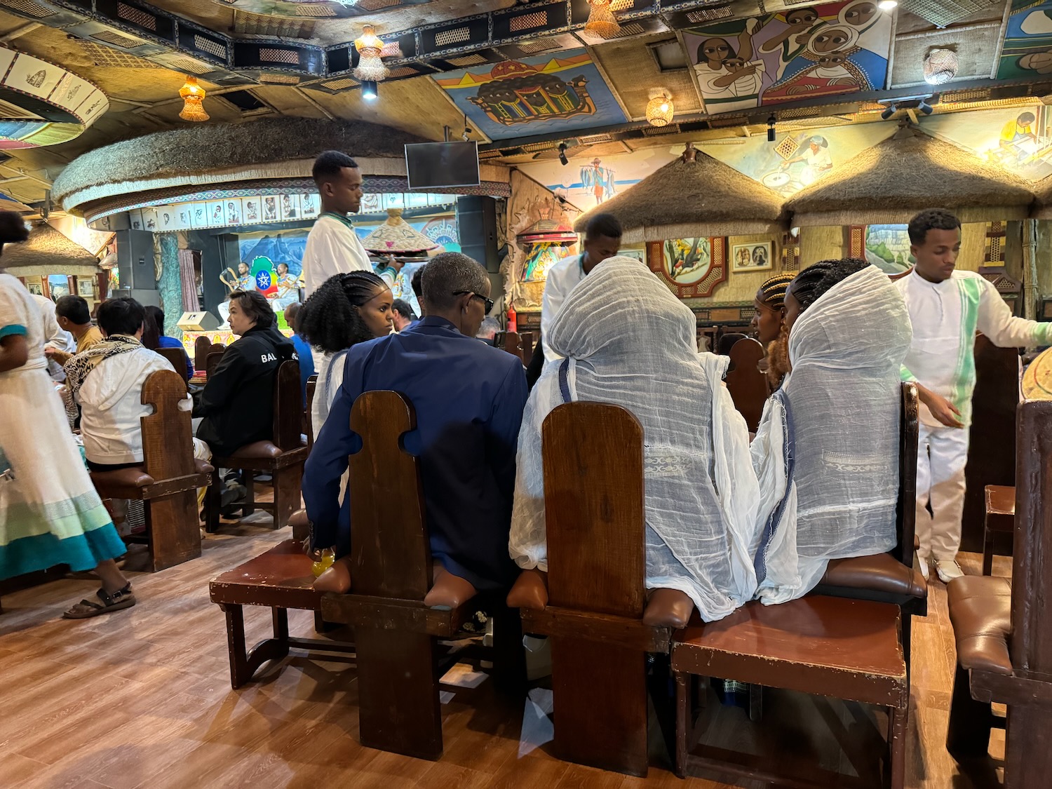 a group of people sitting in chairs in a room