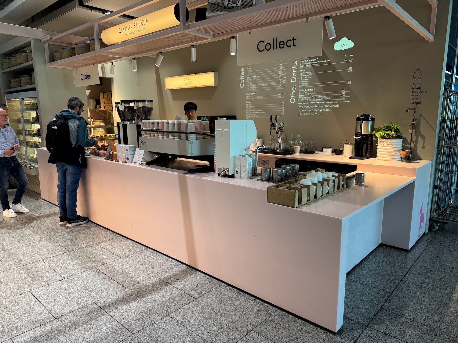 a man standing next to a counter