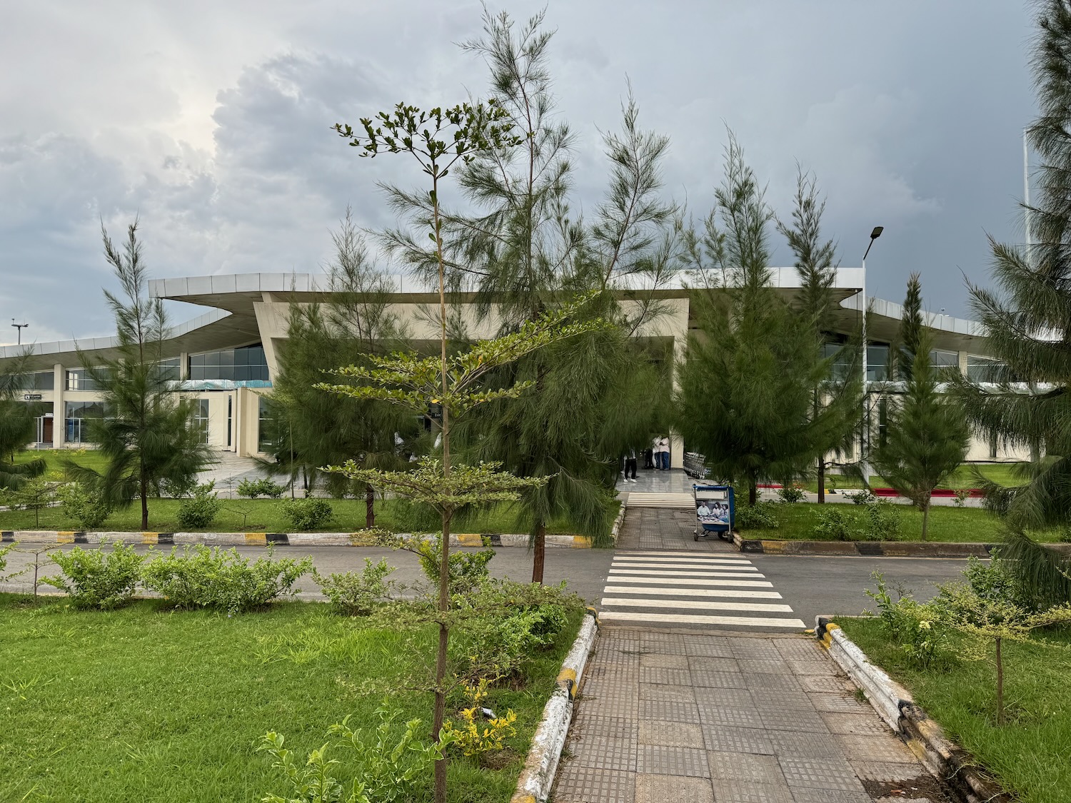 a building with trees and grass