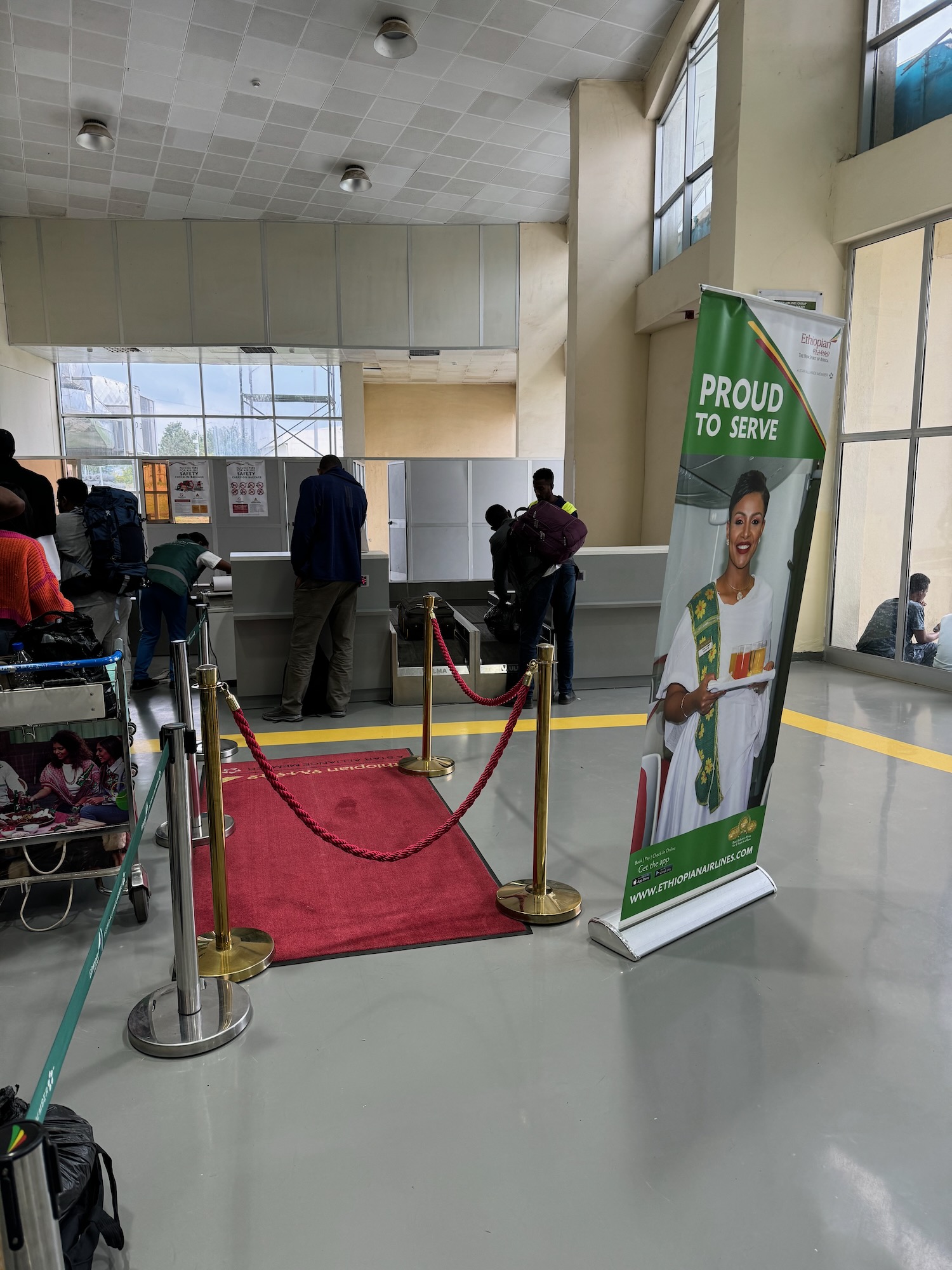 a red carpet with a banner and a poster on it