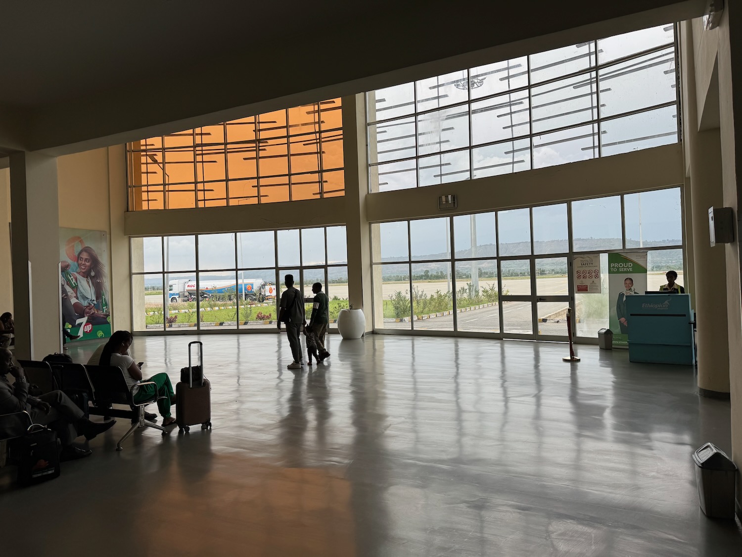 people inside of a building with large windows