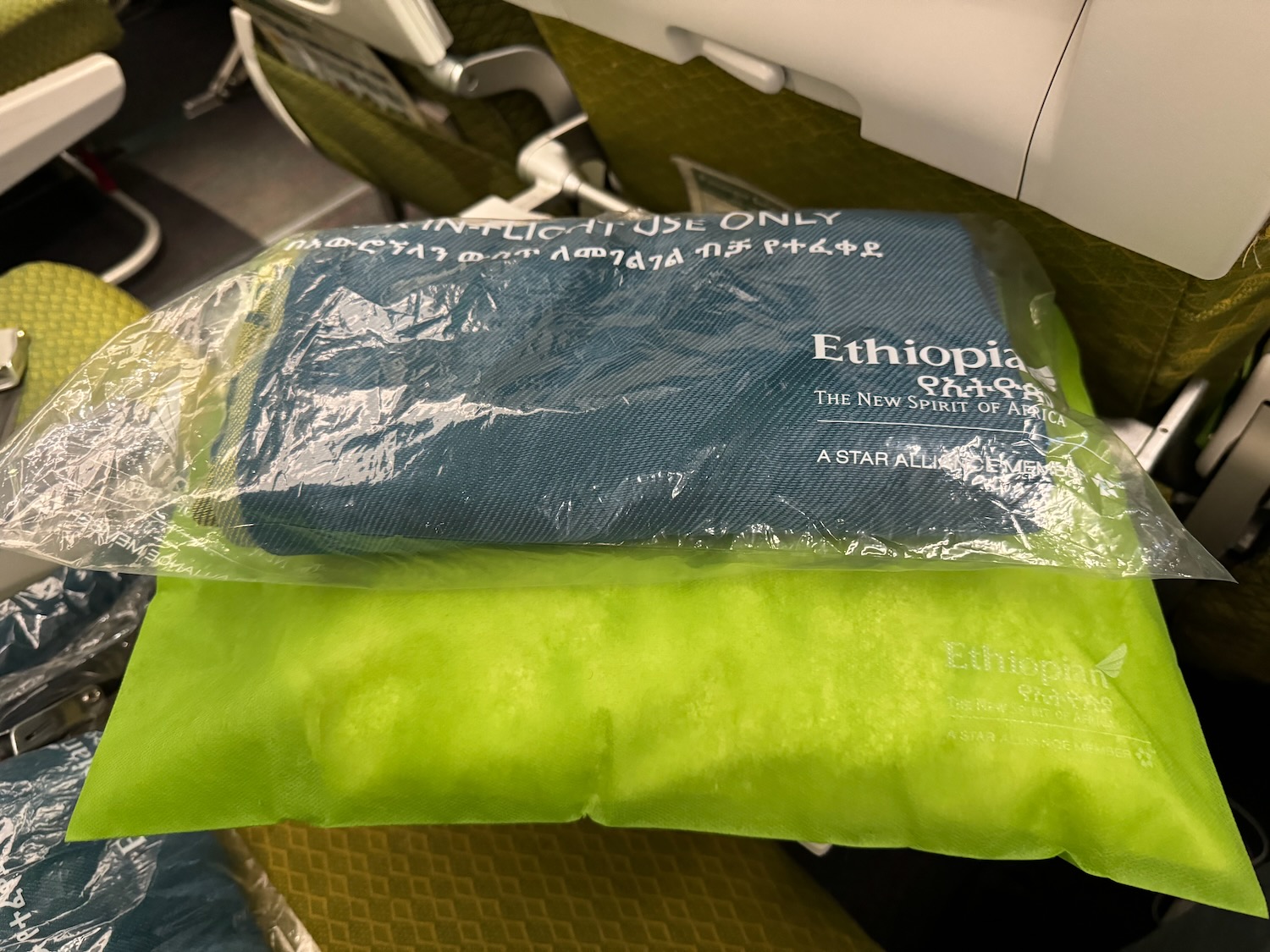 a bag of blue and green towels