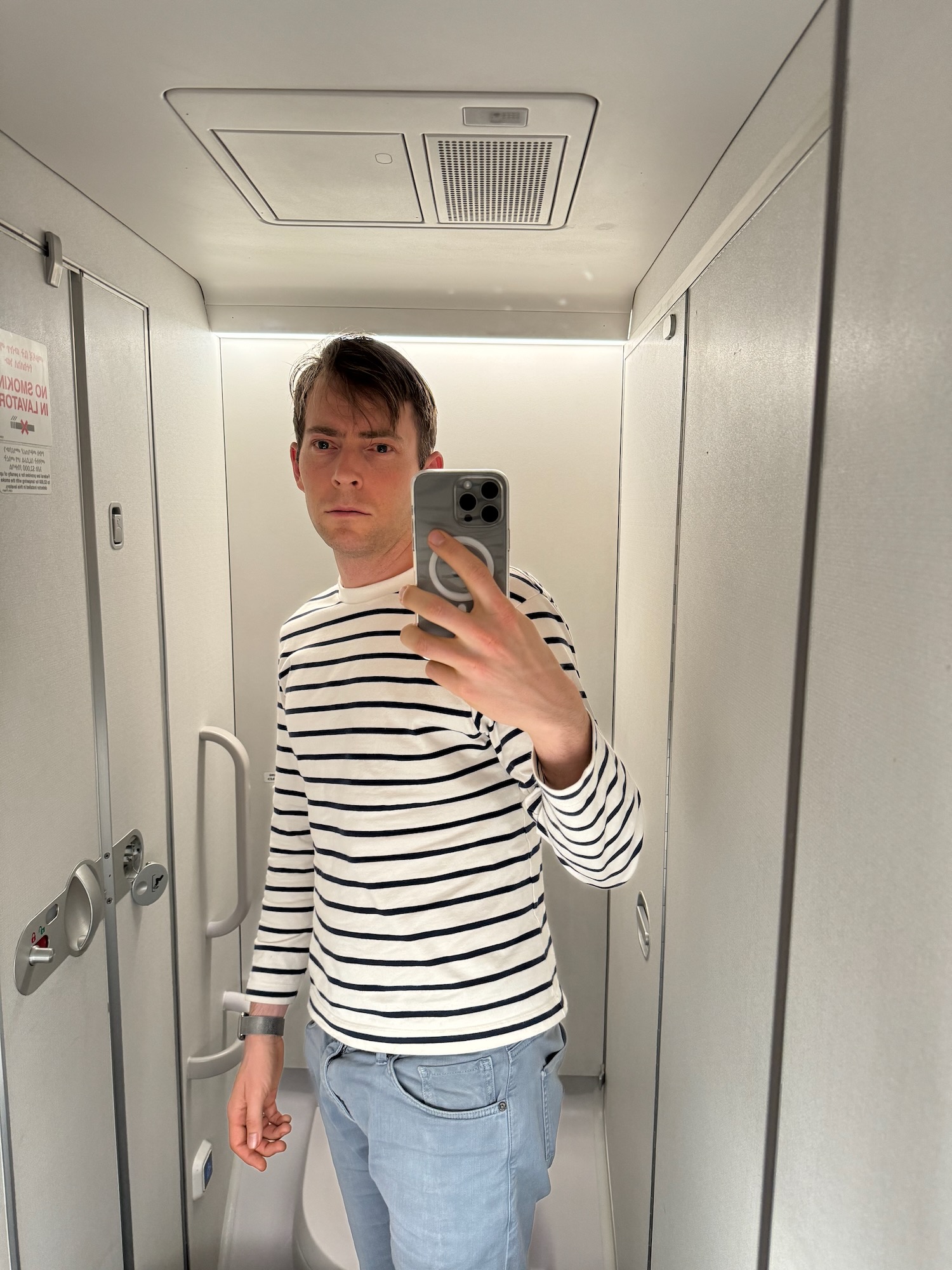 a man taking a selfie in a mirror