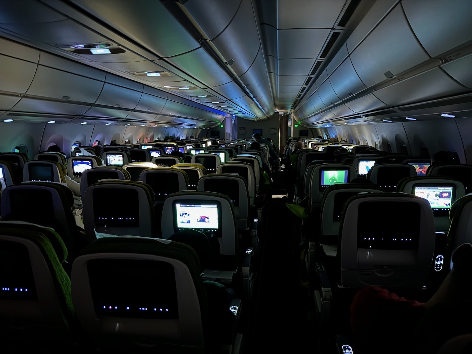 an airplane with seats and monitors