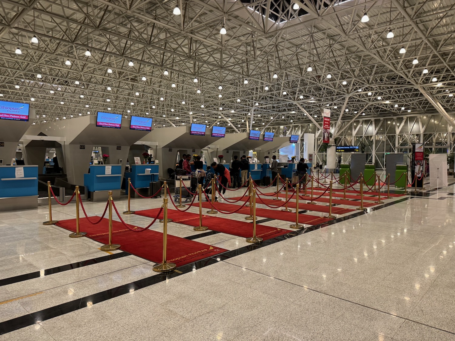people standing in a line in a building