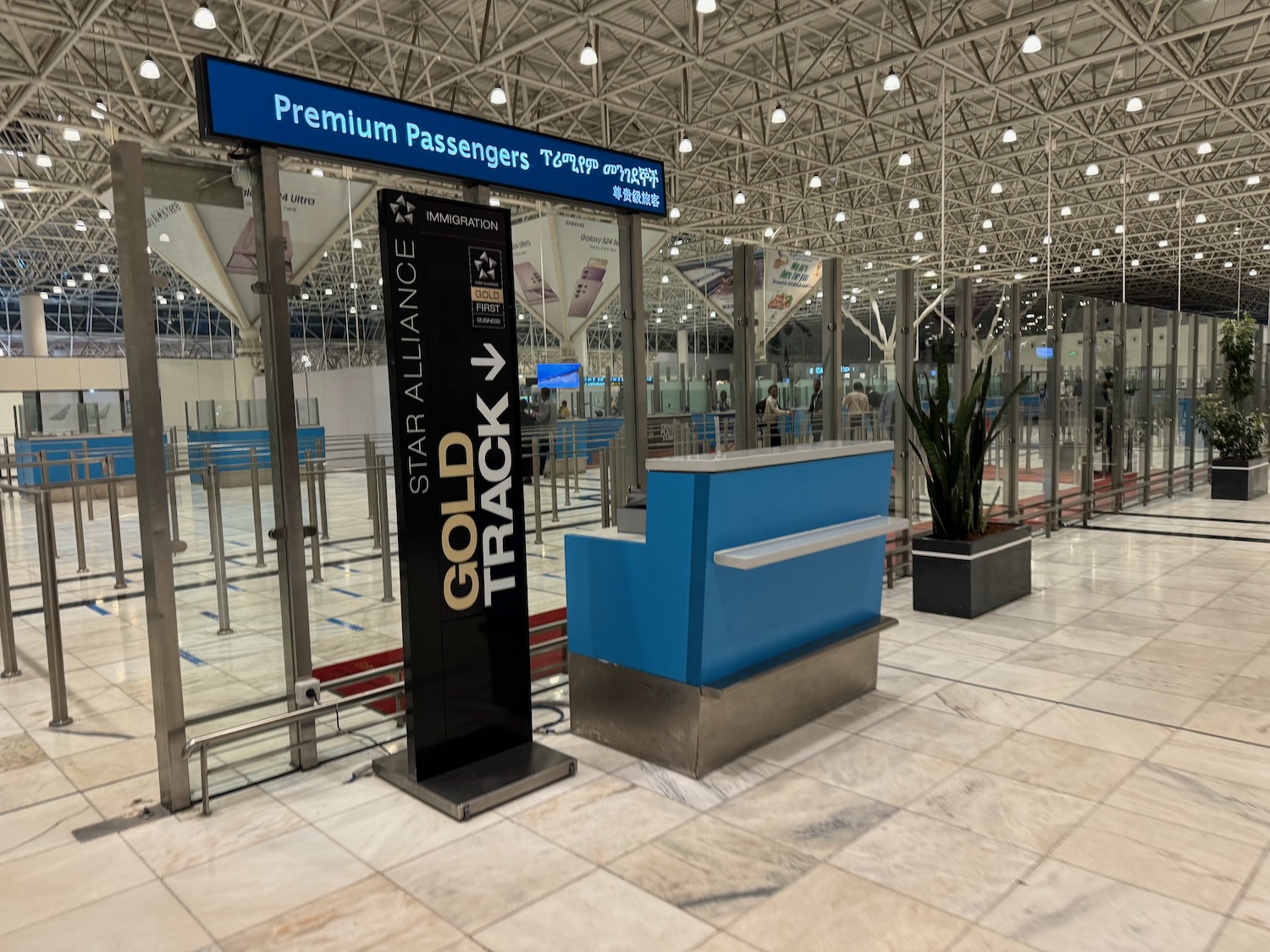 a blue and silver reception desk in a building