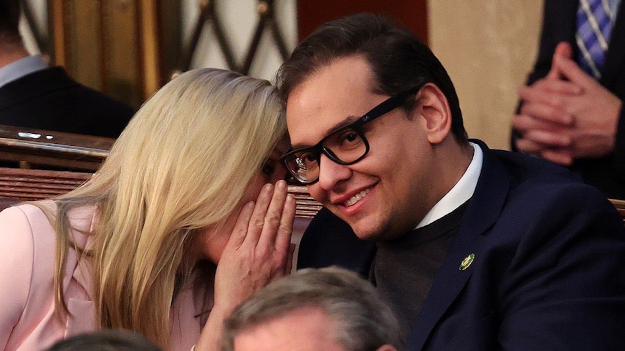 a woman whispering to a man