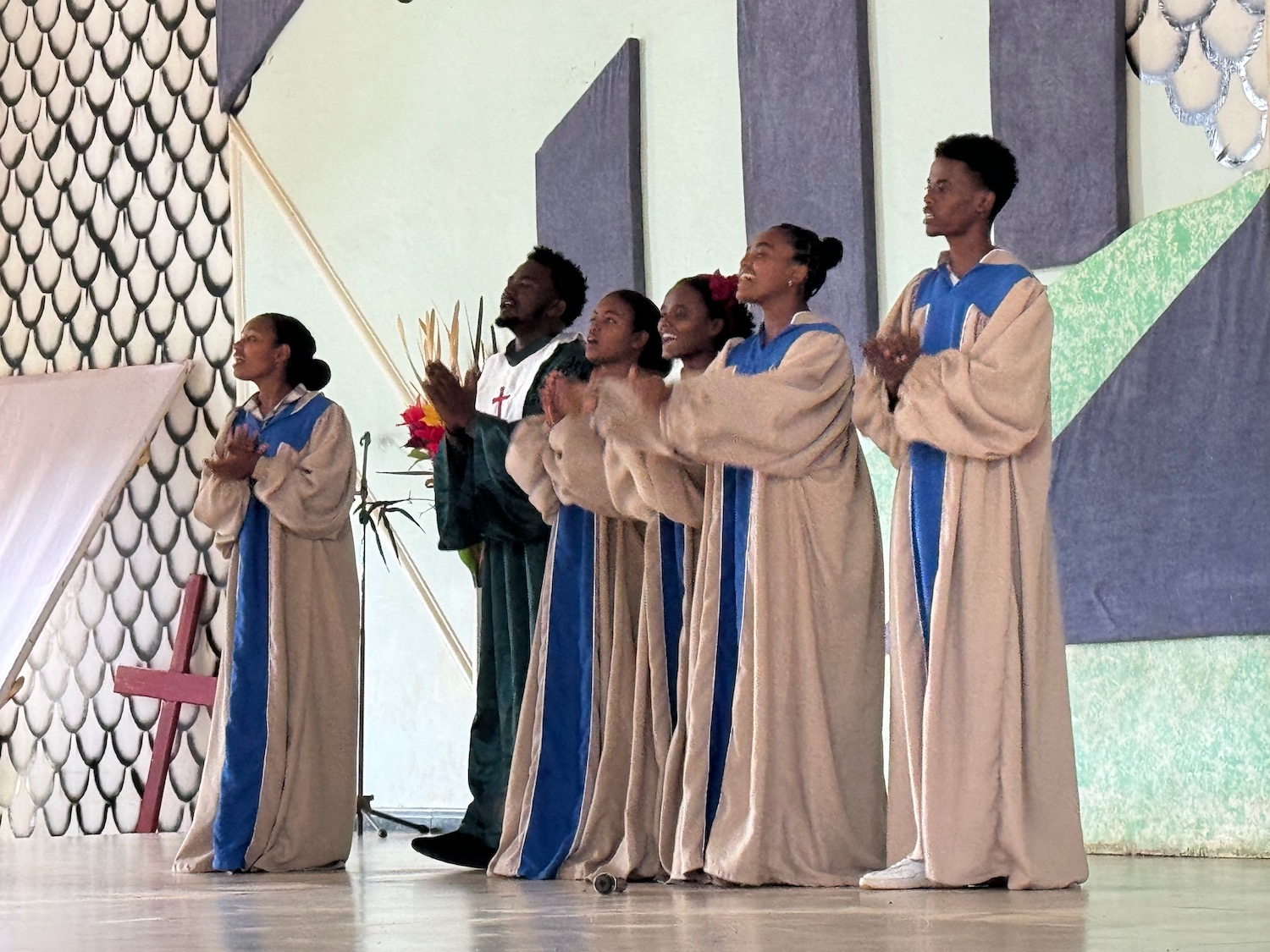 a group of people in white robes