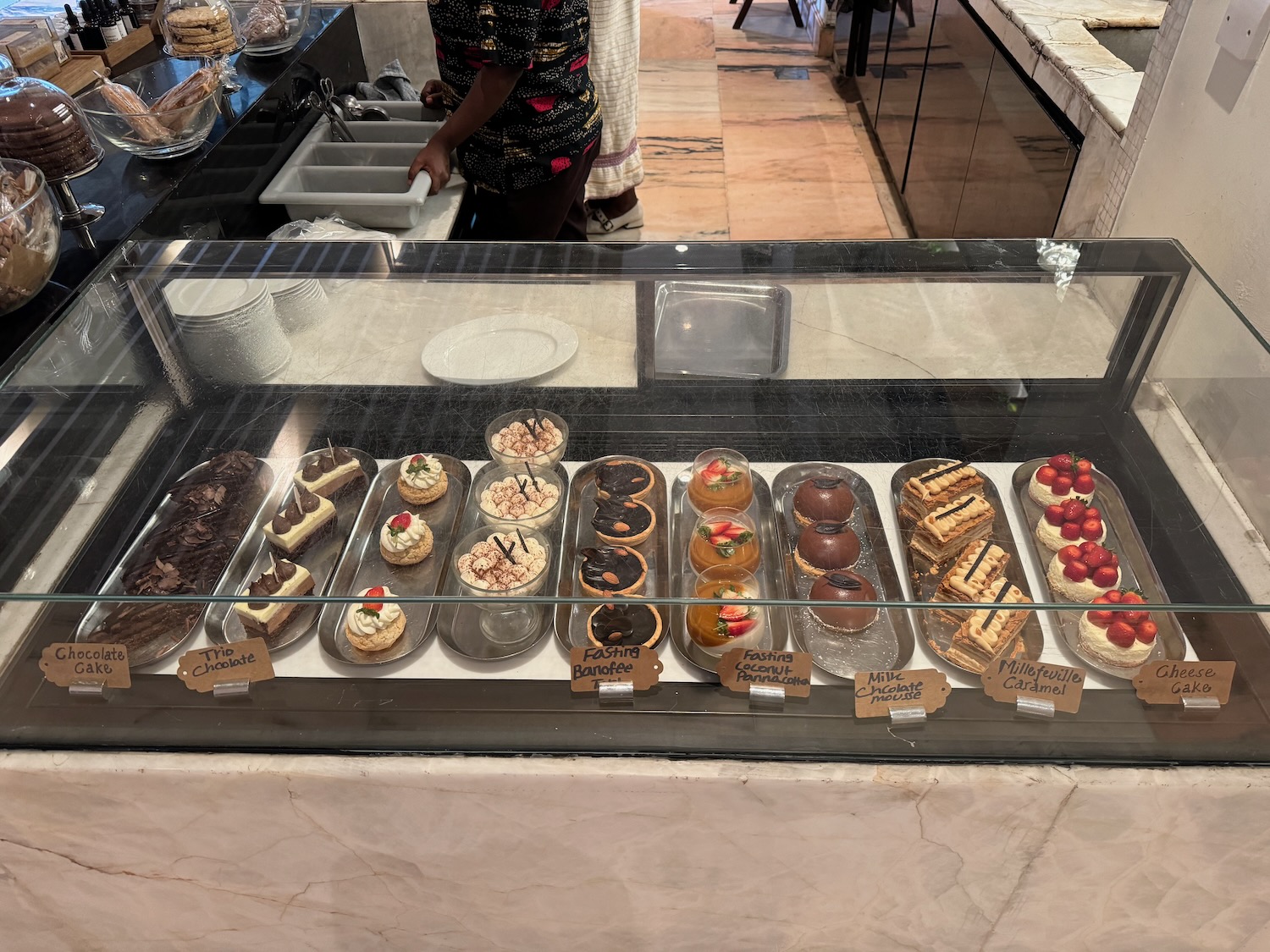 a display case with pastries and desserts