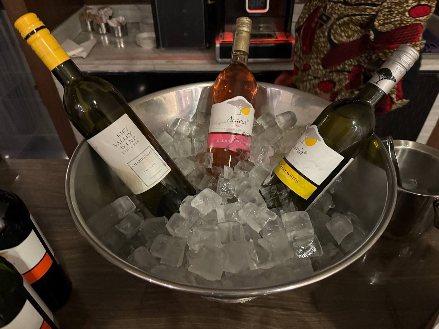 a group of bottles in a bowl of ice
