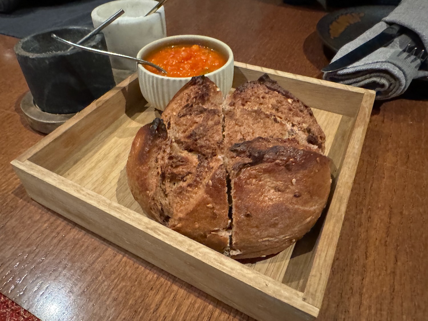 a wooden tray with food on it
