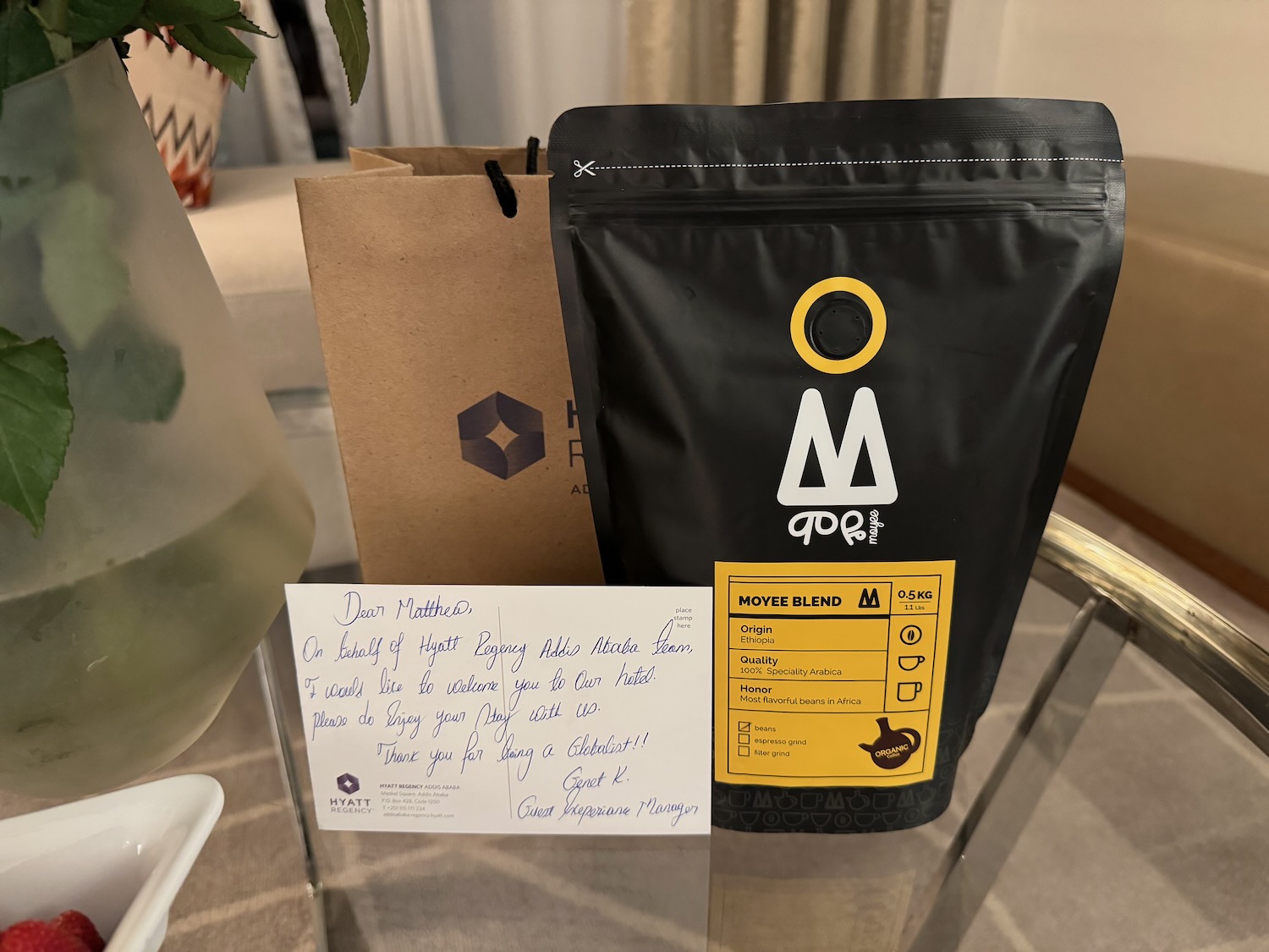 a black bag with a yellow label next to a brown bag