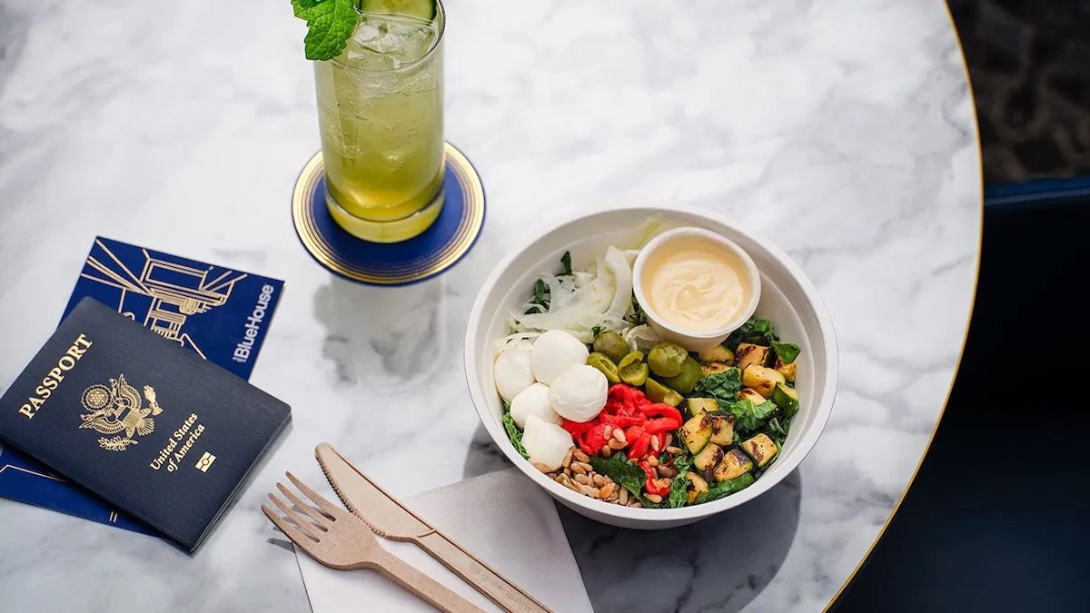 a bowl of food and a drink