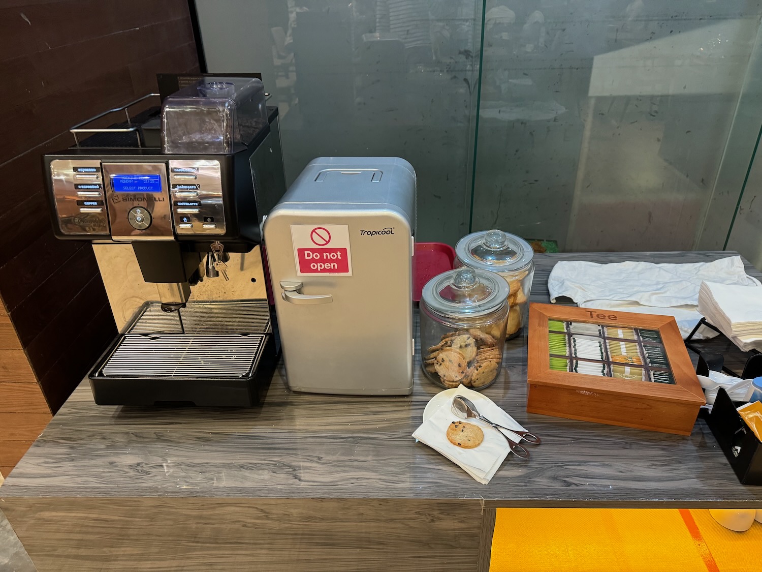 a coffee machine and cookies on a counter