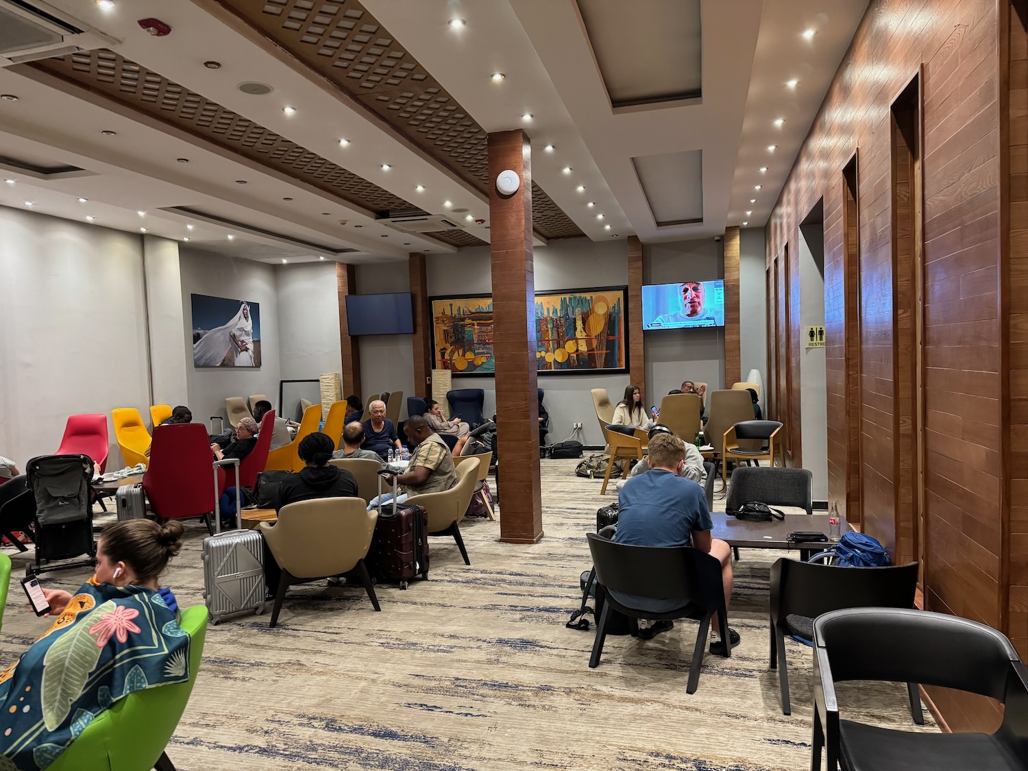 a group of people sitting in chairs in a room