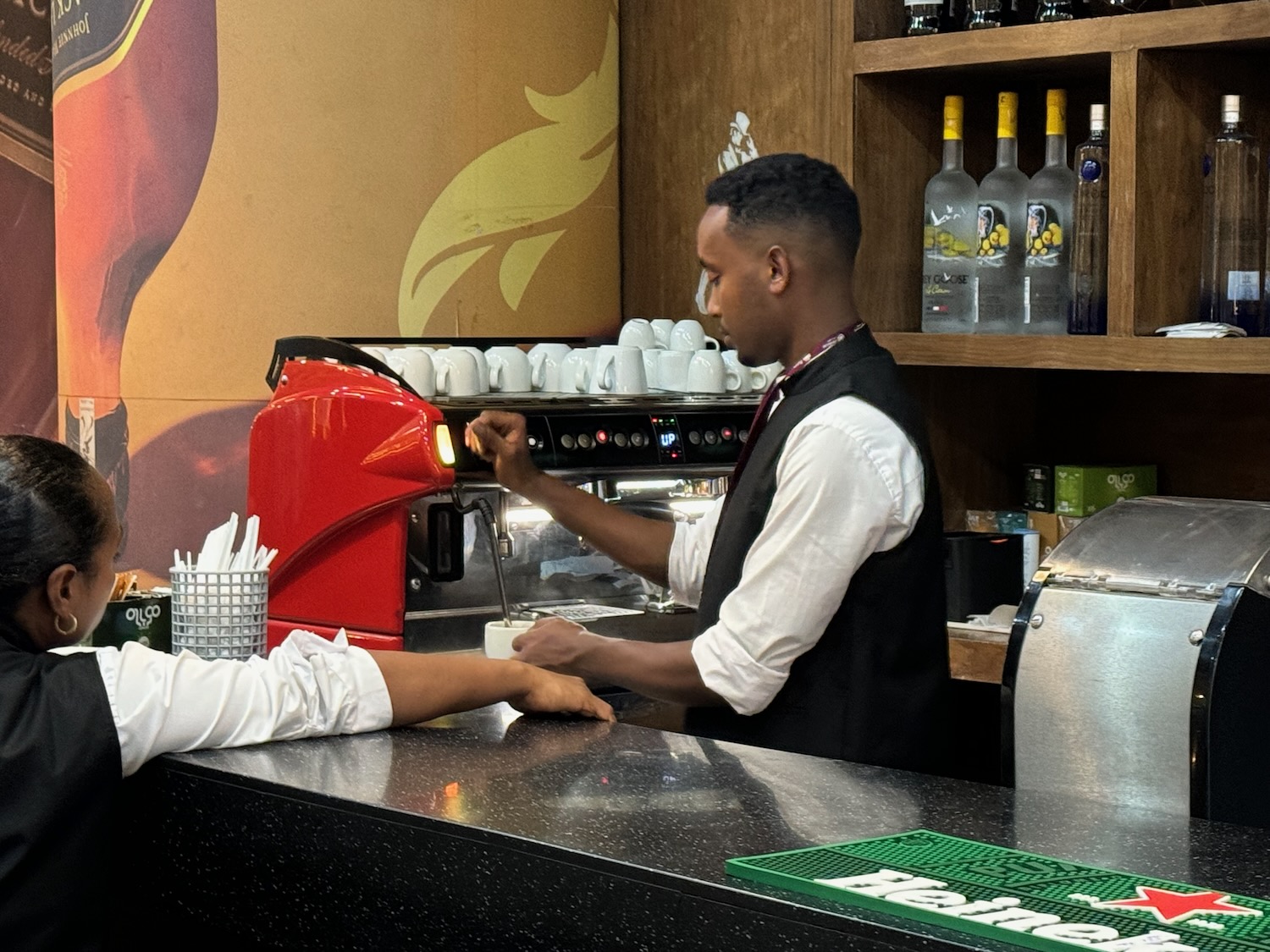 a man pouring coffee into a cup
