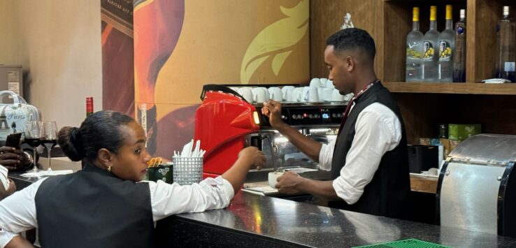 a man and woman at a bar