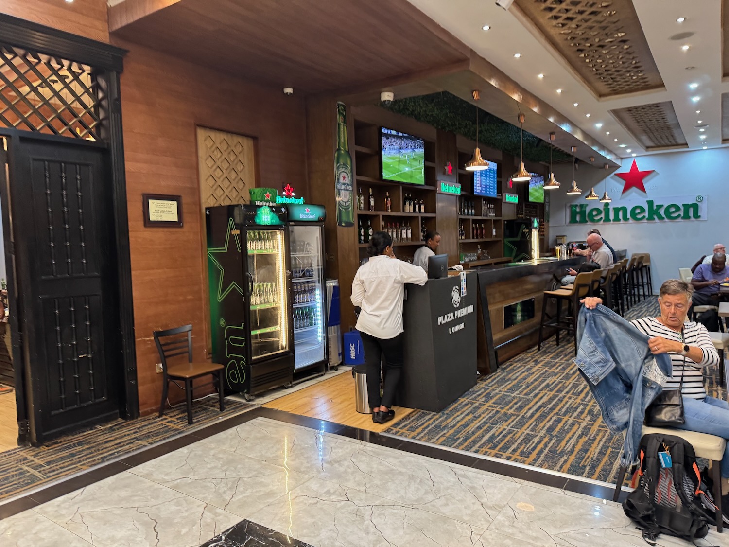 people standing at a bar