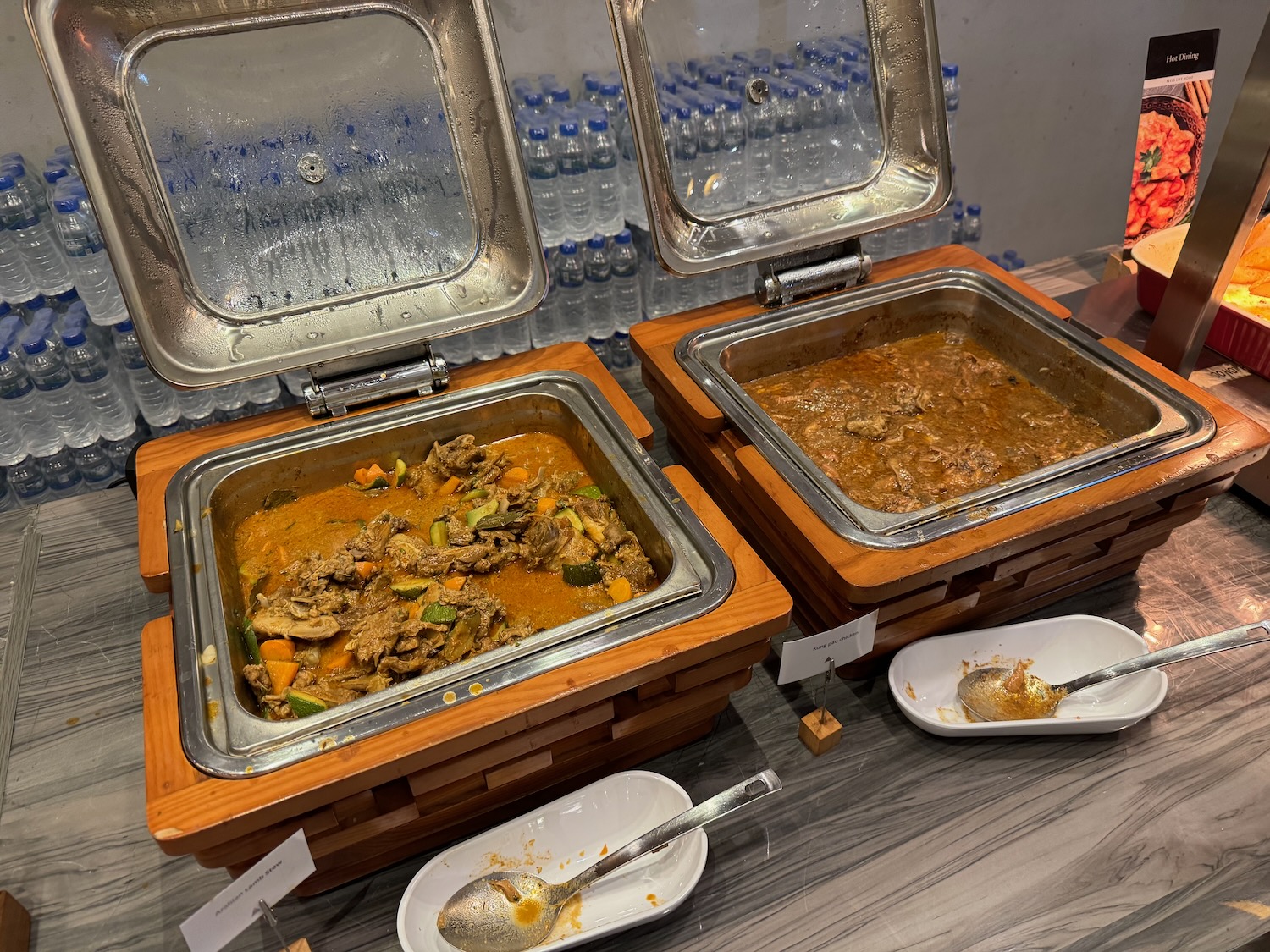 food in a buffet with a couple of containers