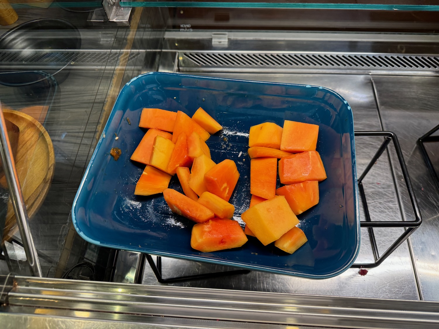 a blue plate with cut fruit on it