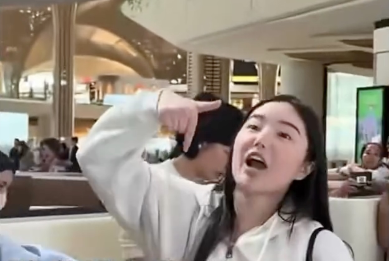 a woman pointing at her finger