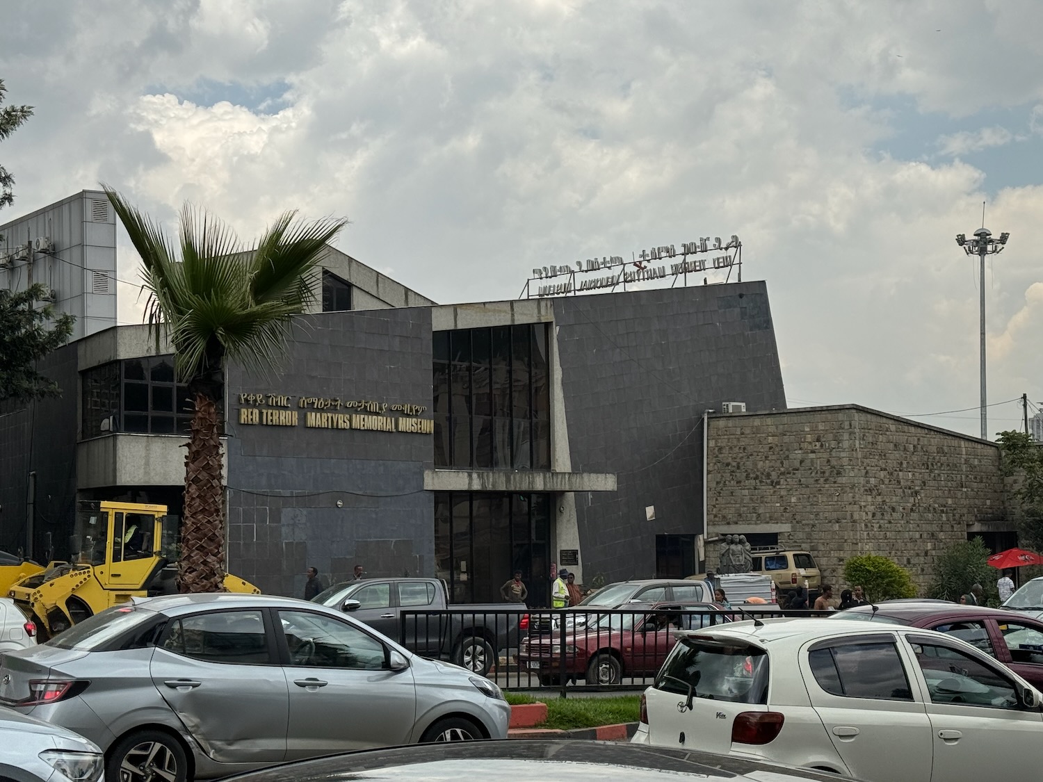 cars parked cars outside a building