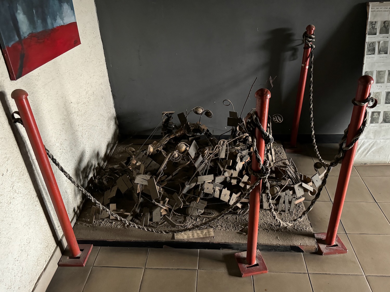 a pile of metal objects on a red pole