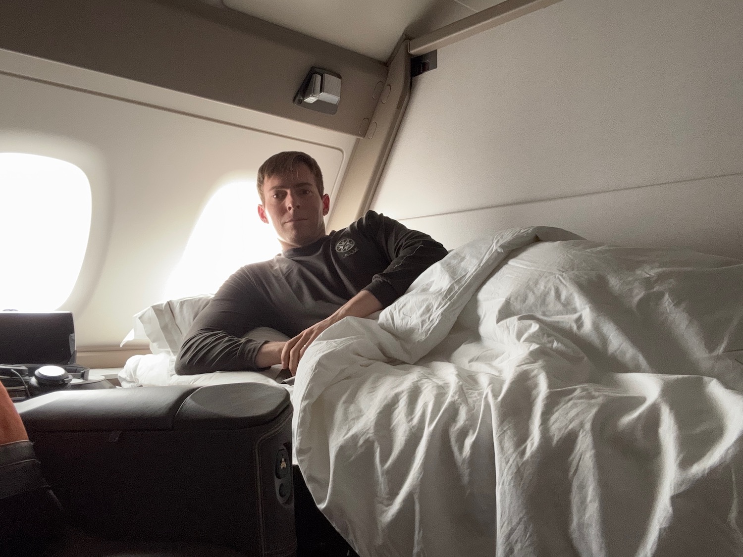 a man lying in a bed