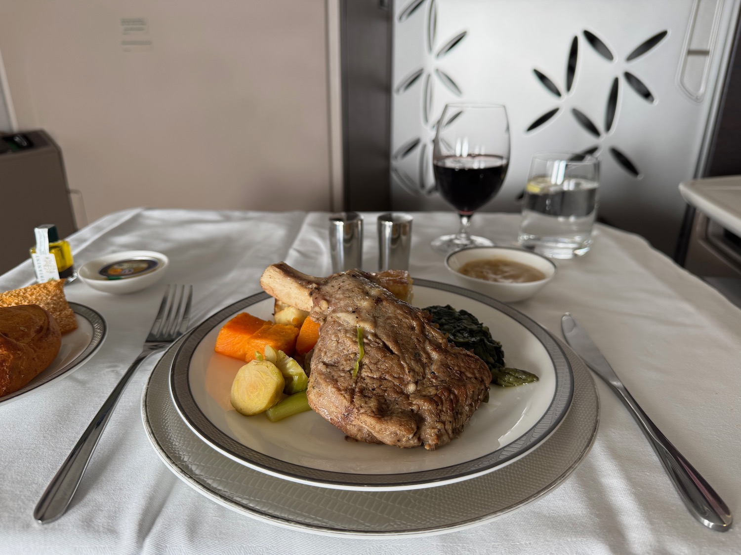 a plate of meat and vegetables on a table