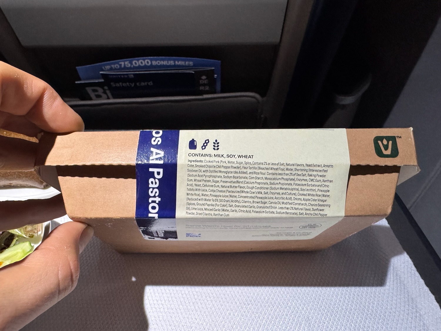 a hand holding a box