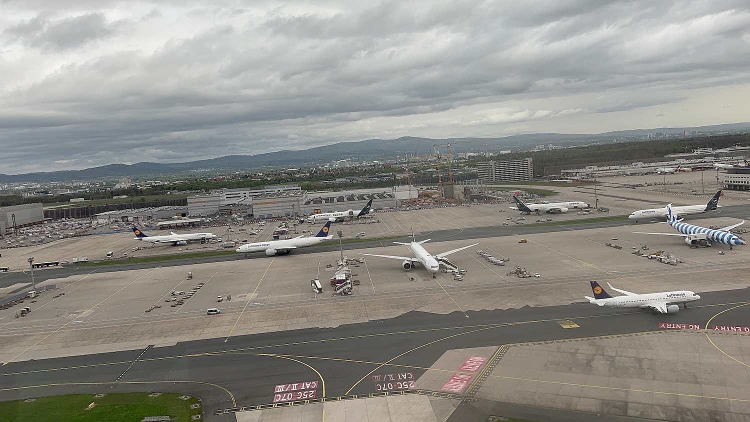 an airport with airplanes on the runway