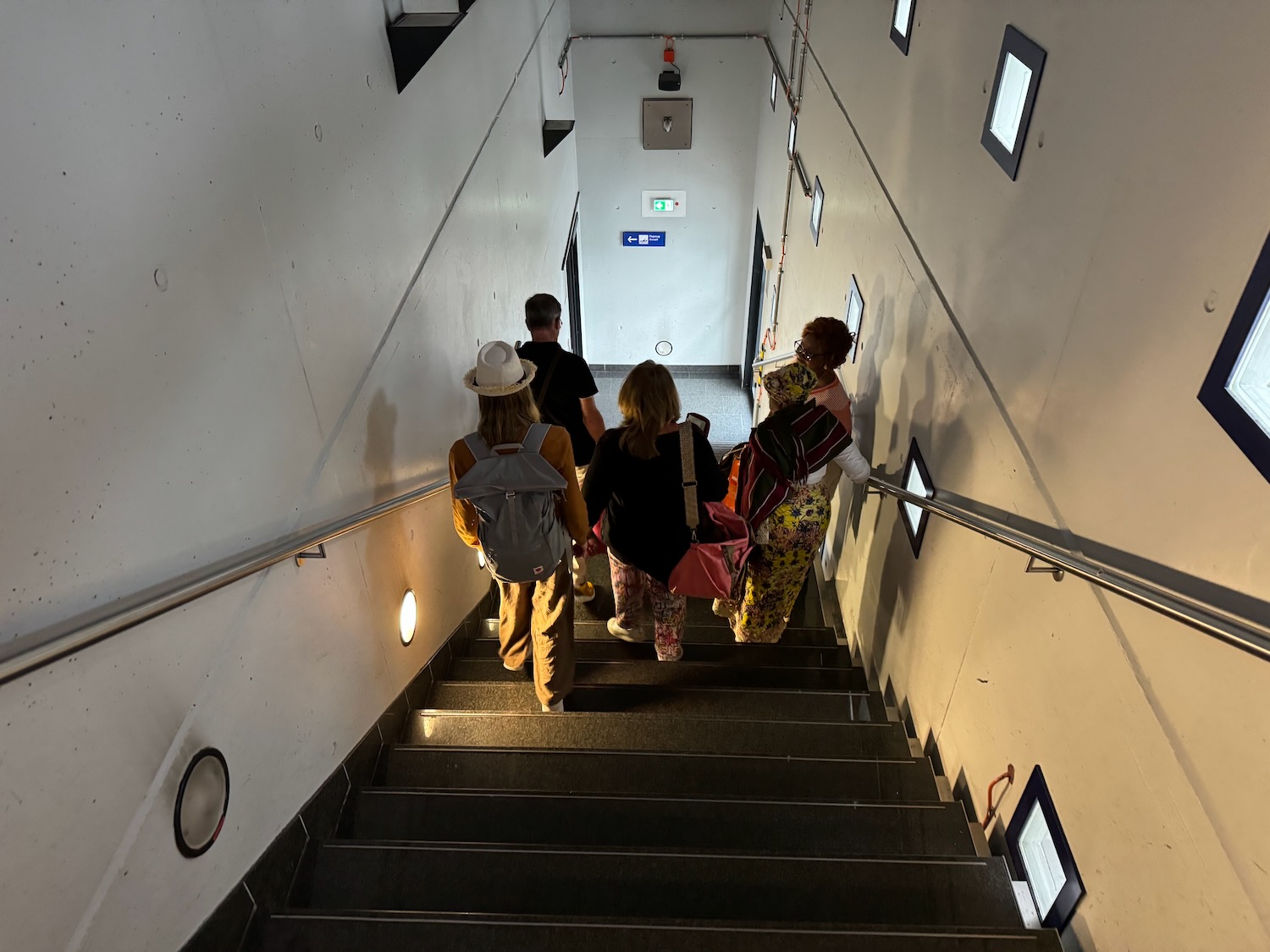a group of people walking up stairs