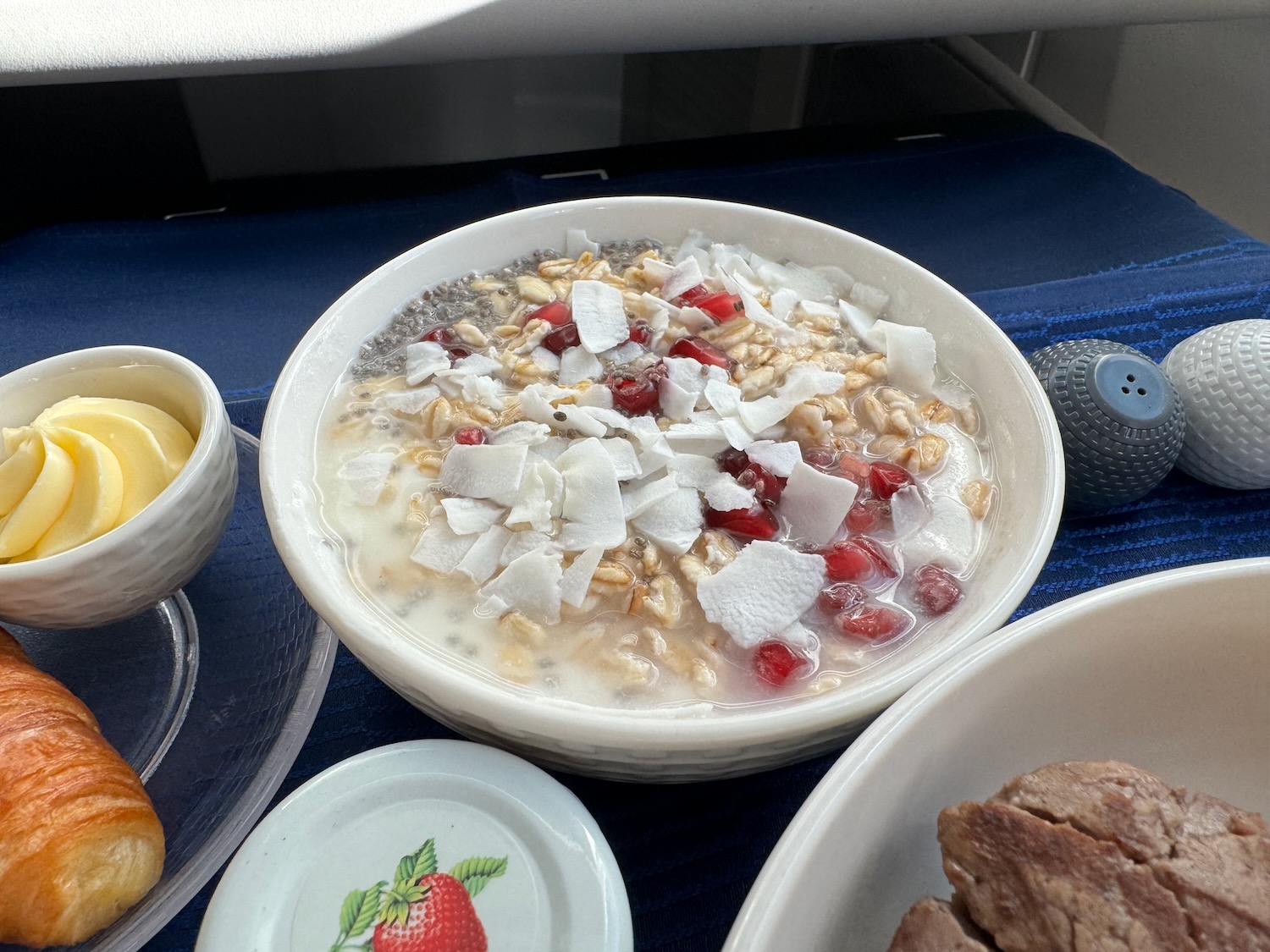 a bowl of oatmeal with fruit and nuts