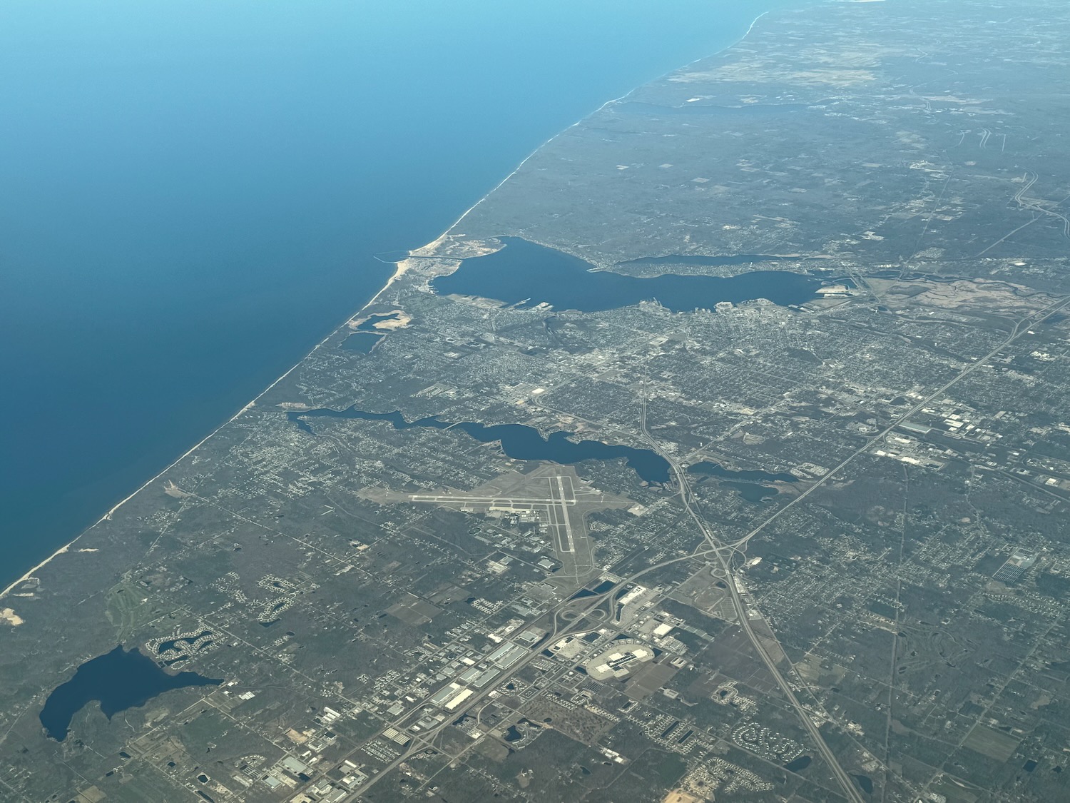 an aerial view of a city and water