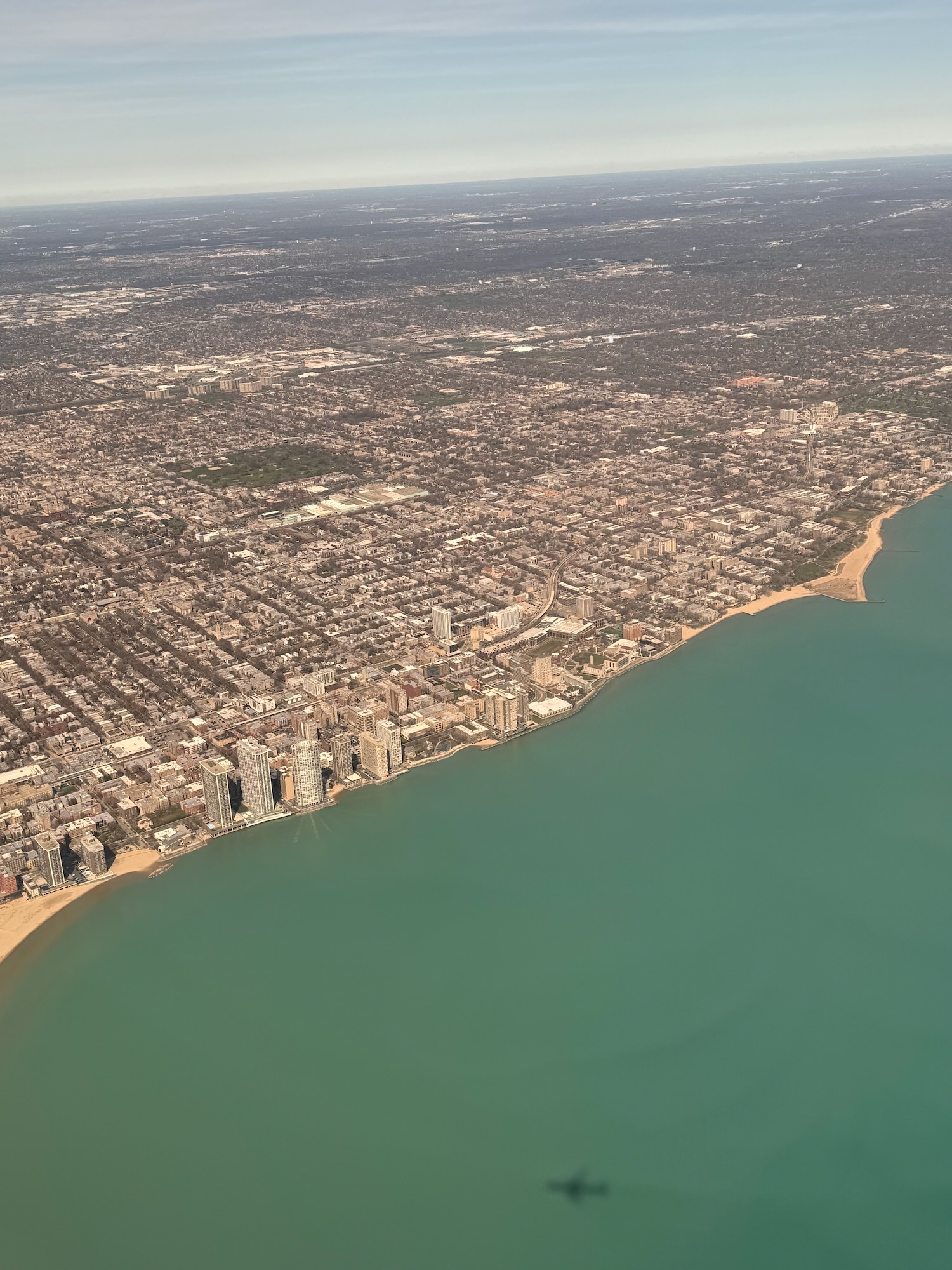 an aerial view of a city and a body of water