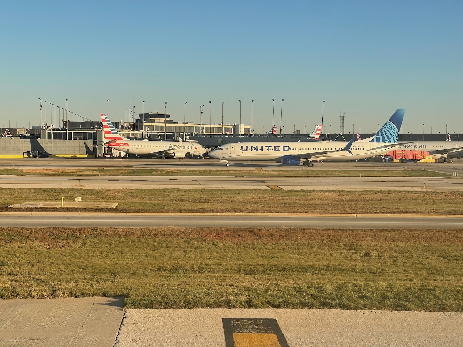 a group of airplanes on a runway