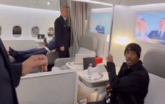 a man sitting in a chair in a plane