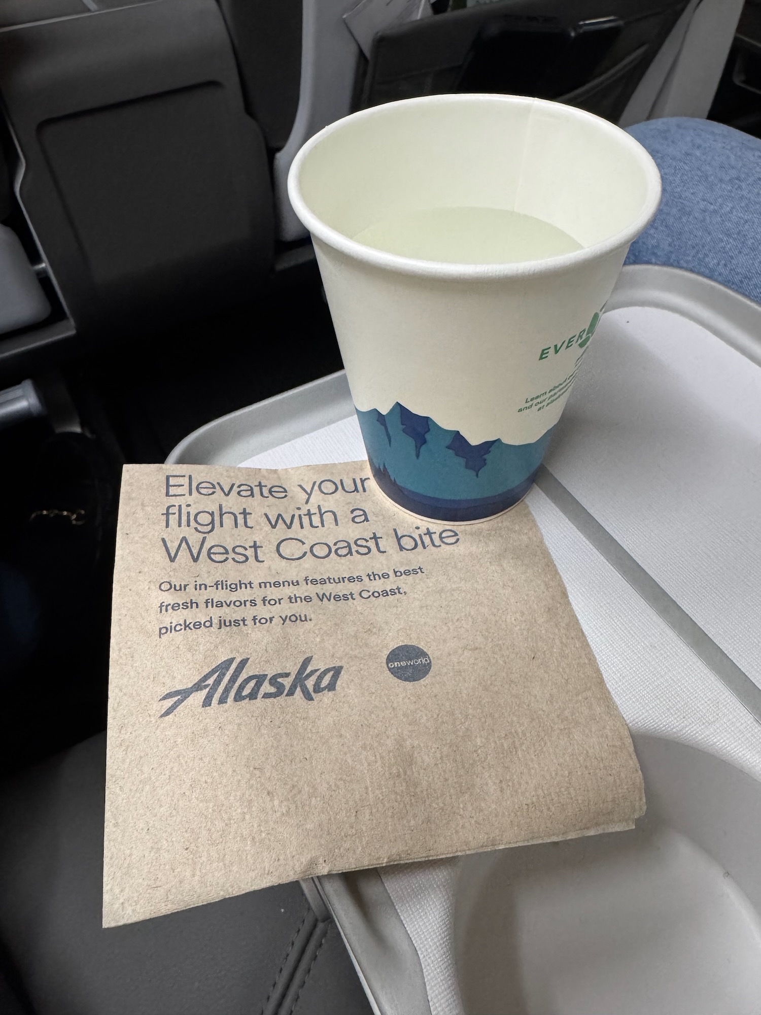 a cup and a napkin on a tray