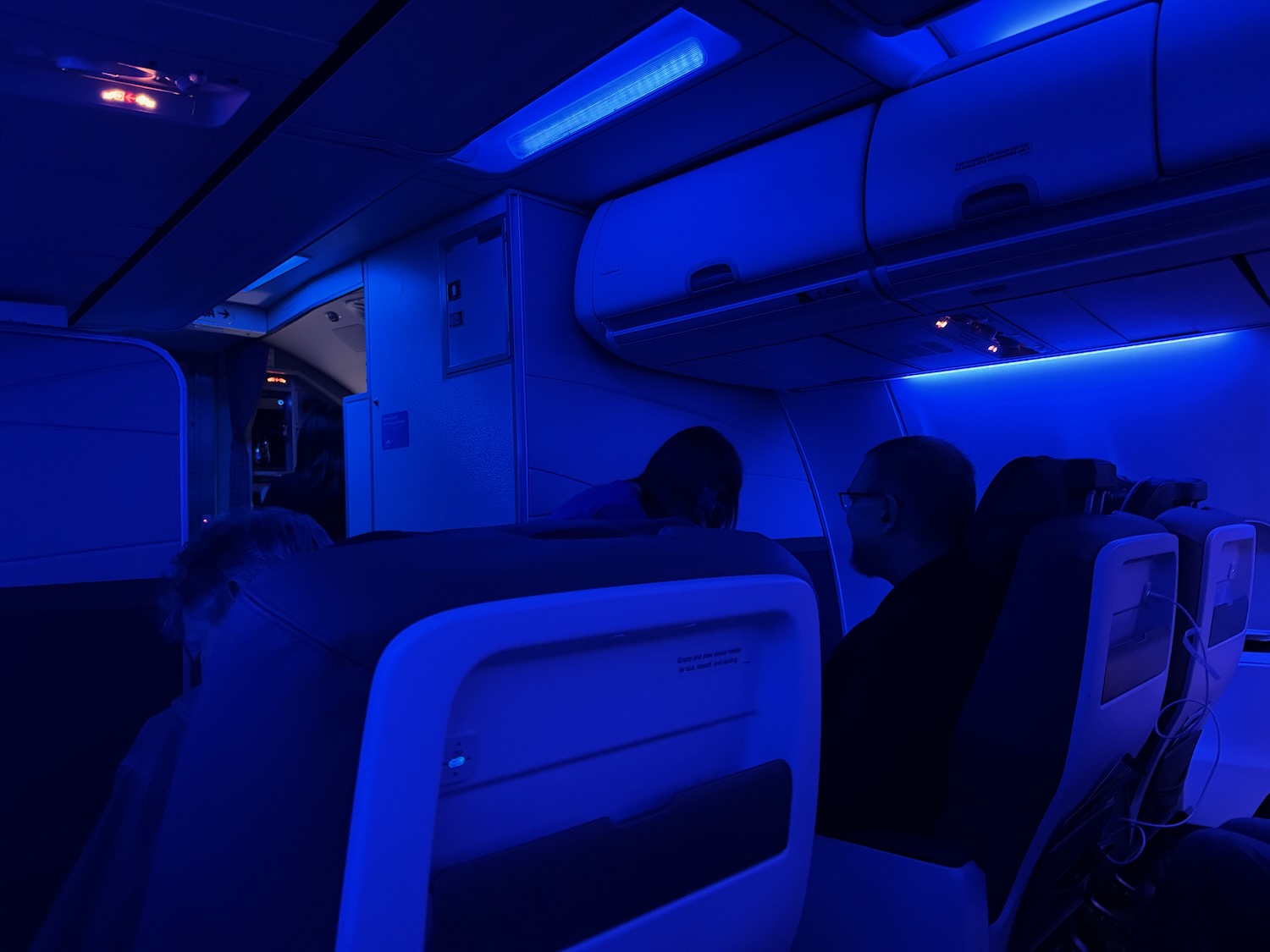 a group of people sitting in an airplane