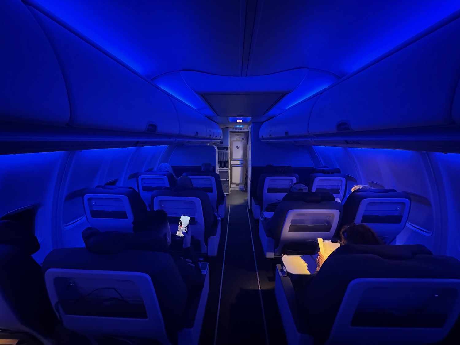 a group of people sitting in a plane