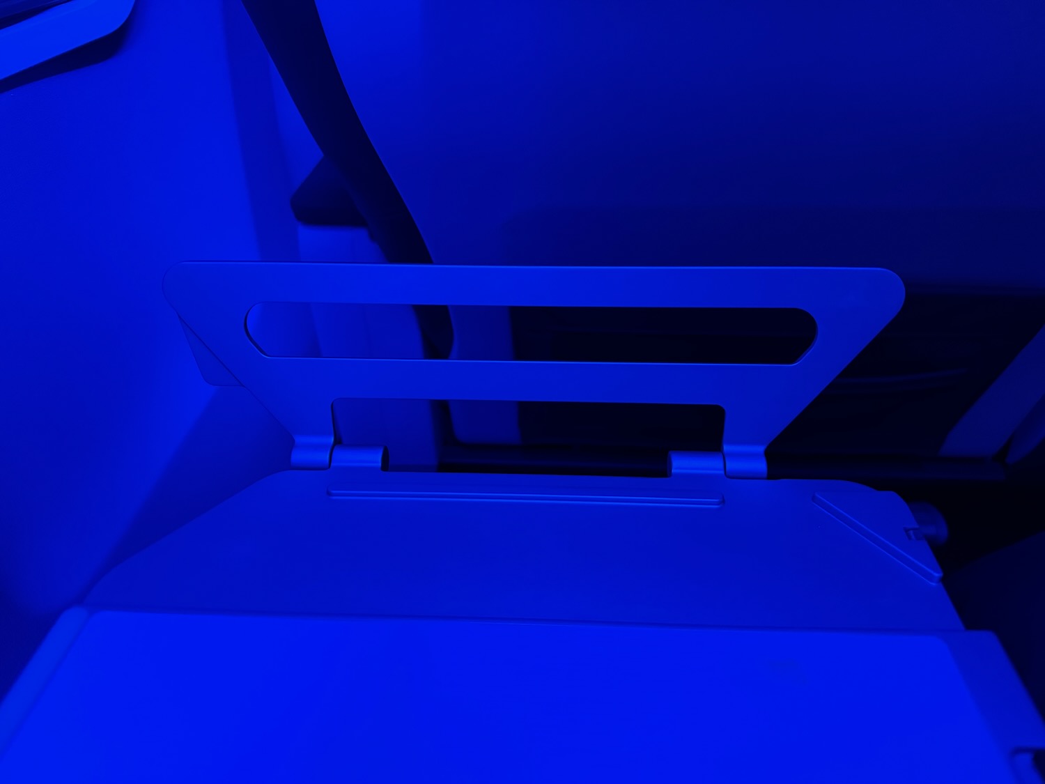 a blue object with a black handle